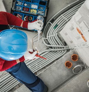 Professional Electrician Checking Wires